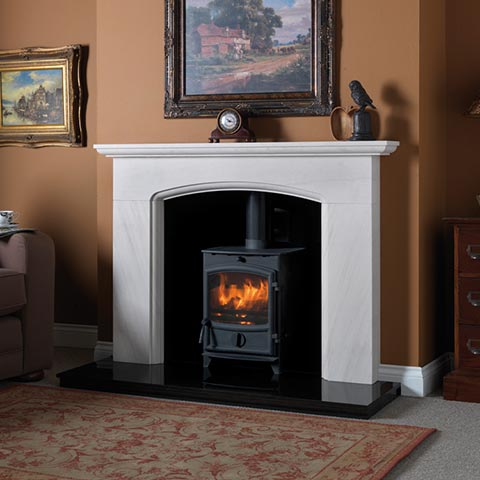 wood bruning stove with marble surround